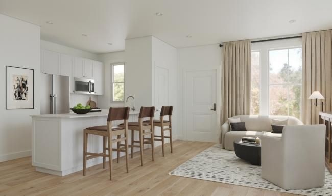 a living room with a dining table and couches